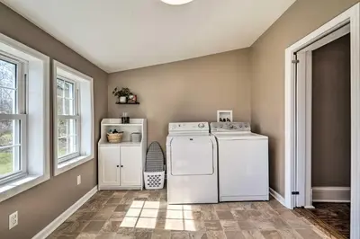 a laundry room with a washer and dryer at Gambier Vacation Rental about 5 Mi to Mt Vernon! in Gambier