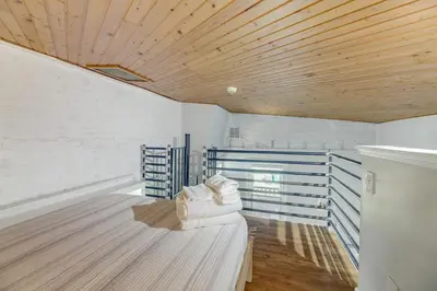 a room with white walls and a wooden ceiling at Cozy Boho-Chic Loft about 2 Mi to Downtown Cincinnati in Cincinnati