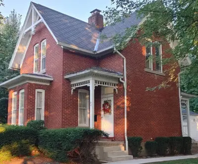 a red brick house with areath on the door at Cedar Point/Kalahari/Lake Erie - Betty's Homestead in Norwalk