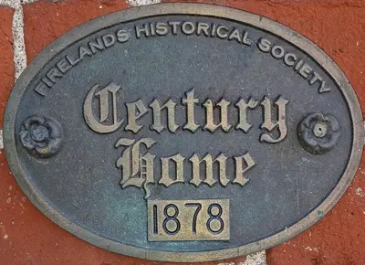 a metal sign on the side of a building at Cedar Point/Kalahari/Lake Erie - Betty's Homestead in Norwalk