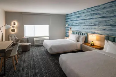 a hotel room with two beds and a desk at TownePlace Suites by Marriott Georgetown in Georgetown