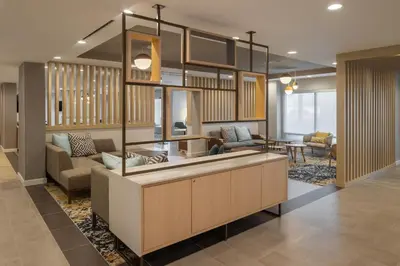 a living room with a couch and a table at TownePlace Suites by Marriott Georgetown in Georgetown