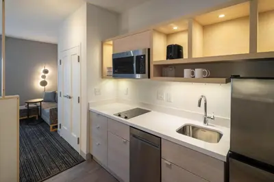 a kitchen with a sink and a microwave at TownePlace Suites by Marriott Georgetown in Georgetown