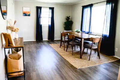 a dining room with a table and chairs at Urban Cottage: Homey & Convenient in Huntington