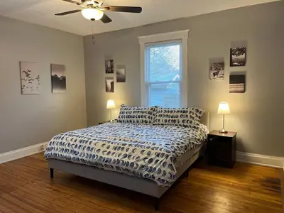 a bedroom with a bed and a ceiling fan at Rolston 1, One Bedroom Unit near Xavier Downtown in Bellevue