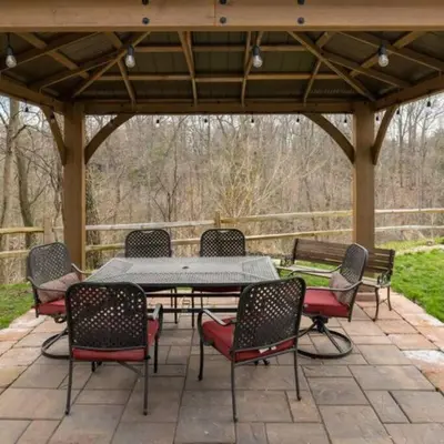 a patio with a table and chairs under a pavilion at King & Queen Memory foam beds! 2-4c Georgetown Villas in Fairview Park