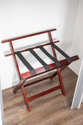 a wooden stool sitting on top of a wooden floor at King & Queen Memory foam beds! 2-4c Georgetown Villas in Fairview Park