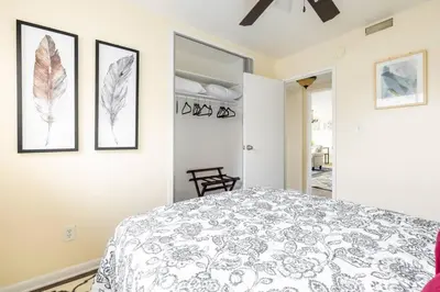 a bedroom with a bed and two pictures on the wall at King & Queen Memory foam beds! 2-4c Georgetown Villas in Fairview Park