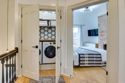 a laundry room with a washer and dryer at Indiana Vacation Rental Walk to Madison Main St! in Madison