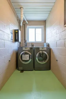 a laundry room with two washing machines in it at Near CLE airport and Valley 2-4a Georgetown Villas in Fairview Park