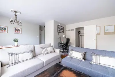 a living room with a couch and a table at Near CLE airport and Valley 2-4a Georgetown Villas in Fairview Park