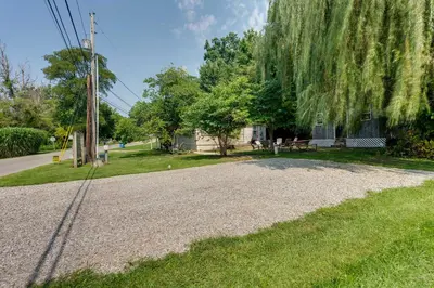 a gravel driveway in front of a house at Lakeside Indiana Vacation Rental Near Fort Wayne! in Churubusco