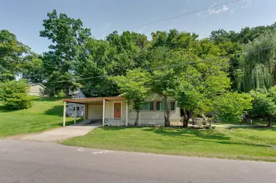 a small house with a road in front of it at Lakeside Indiana Vacation Rental Near Fort Wayne! in Churubusco