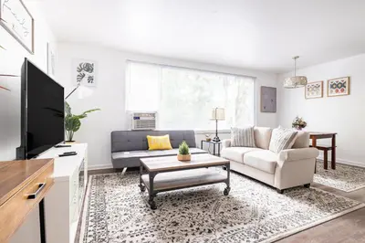 a living room with a couch and a tv at Two Bedrooms near CLE airport 2-4b Georgetown Villas in Fairview Park