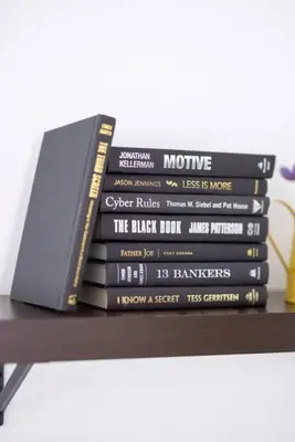 a stack of books sitting on top of a table at Two Bedrooms near CLE airport 2-4b Georgetown Villas in Fairview Park