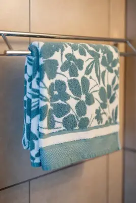 a towel hanging on a towel rack in a bathroom at Courtyard View near Valley 2-2a Georgetown Villas in Fairview Park