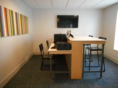 an office with a desk with chairs and a computer at Holiday Inn Express Fairfield by IHG in Fairfield