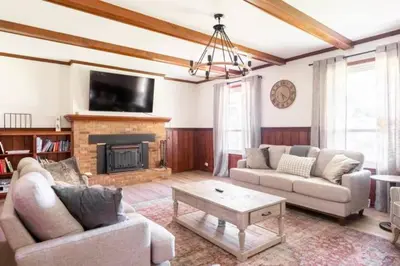 a living room with two couches and a fireplace at 100 Acre Red Brick Ranch Hocking Hills Cabin Hot Tub 12 in Logan