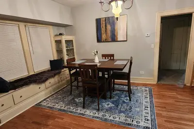 a dining room with a wooden table and chairs at Comfy 3brd in Cleveland in Cleveland Heights