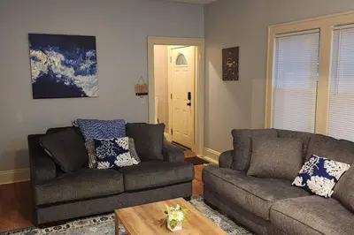 a living room with two couches and a coffee table at Comfy 3brd in Cleveland in Cleveland Heights