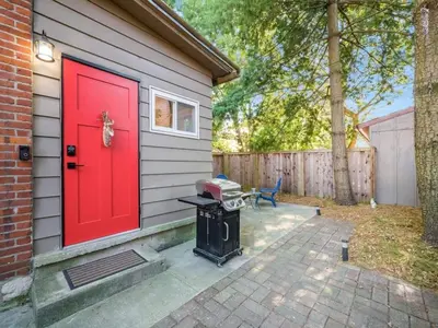 a red door on the side of a house at Pet-Friendly German Village Haus Wifi Walkable in Columbus