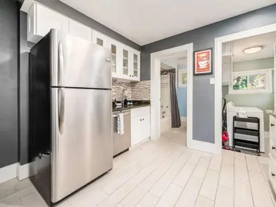 a kitchen with a stainless steel refrigerator at Pet-Friendly German Village Haus Wifi Walkable in Columbus