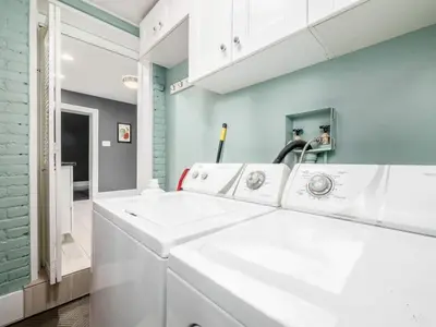 a white laundry room with three sinks at Pet-Friendly German Village Haus Wifi Walkable in Columbus