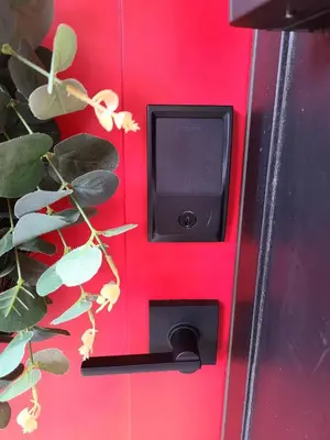 a red door with a black handle on a red wall at Pet-Friendly German Village Haus Wifi Walkable in Columbus