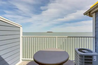 a toilet sitting on a balcony with the ocean at Waterfront Middle Bass Condo with Lake Erie Views! in Middle Bass