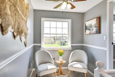 a living room with two chairs and a window at Quiet Kentucky Vacation Rental with Hot Tub in Berry