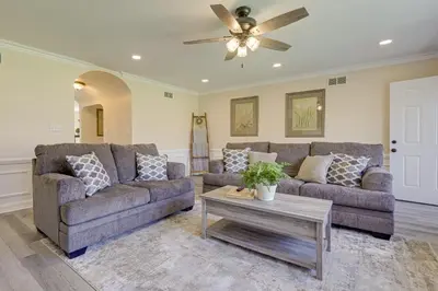 a living room with two couches and a coffee table at The Windmill House with Pond 9 Mi to Dayton! in Dwyer