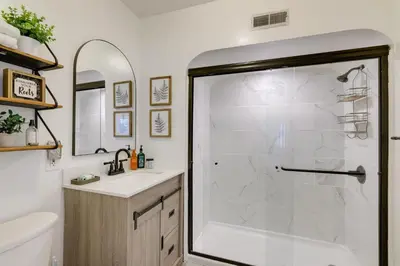 a bathroom with a shower and a sink at The Windmill House with Pond 9 Mi to Dayton! in Dwyer