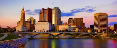a city skyline with a bridge over a river at King BR minutes from downtown in Columbus
