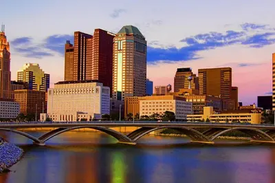 a bridge over a river in a city with buildings at King BR minutes from downtown in Columbus