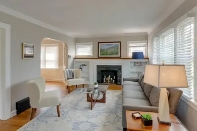 a living room with a couch and a fireplace at Walk to Lake Erie Chic Home, Private Yard and Deck in Avon Lake