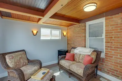 a living room with two chairs and a couch at Walk to Lake Erie Chic Home, Private Yard and Deck in Avon Lake