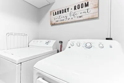 a laundry room with a washer and dryer at The Cranbrook- Close to OSU-Downtown Columbus-Short North-Clintonville-Upper Arlington in Columbus