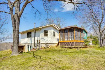 a house with a tree in front of it at Athens Vacation Rental - 6 Mi to Ohio University! in Athens