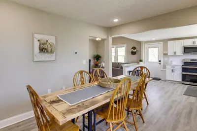 a kitchen and dining room with a wooden table and chairs at Williamstown Vacation Rental Private Deck and Yard in Williamstown