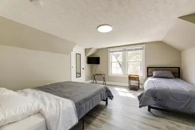 a bedroom with two beds and a window at Williamstown Vacation Rental Private Deck and Yard in Williamstown