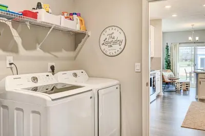 a laundry room with a washer and dryer at Spacious Home with Patio Near Fishers! in Fishers
