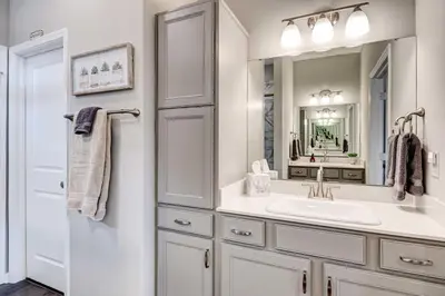 a bathroom with a sink and a mirror at Spacious Home with Patio Near Fishers! in Fishers
