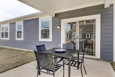 a dining table and chairs on a patio at Spacious Home with Patio Near Fishers! in Fishers