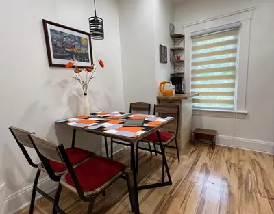 a dining room with a table and four chairs at Trendy in Tremont, Cleveland (Upper) in Cleveland