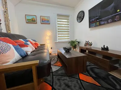 a living room with a couch and a table at Trendy in Tremont, Cleveland (Upper) in Cleveland